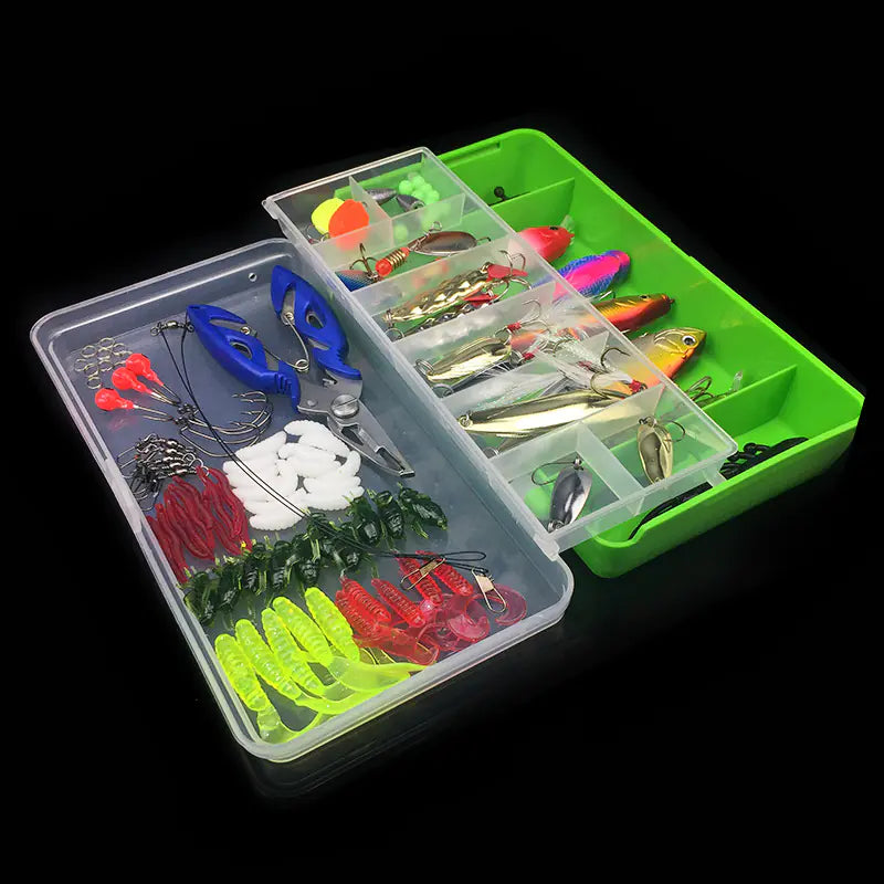 Fishing lure set in a green and clear tackle box on a black background