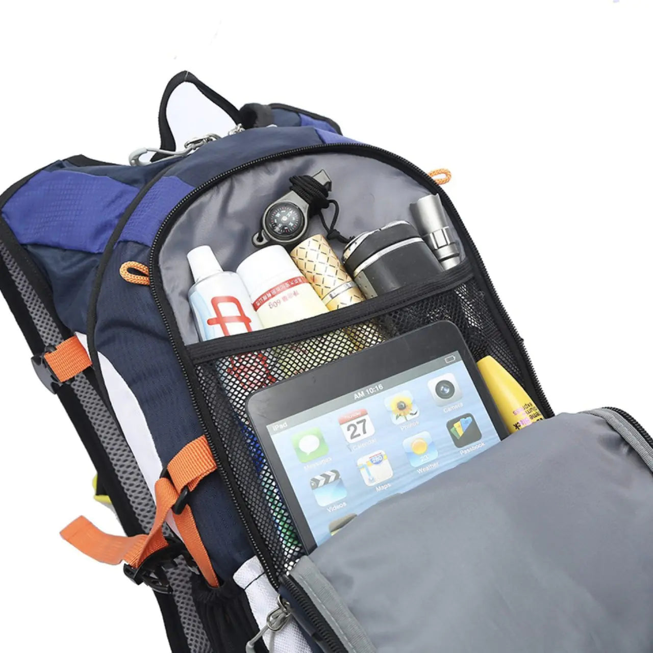 Open backpack with various items including a tablet, bottles, and snacks.