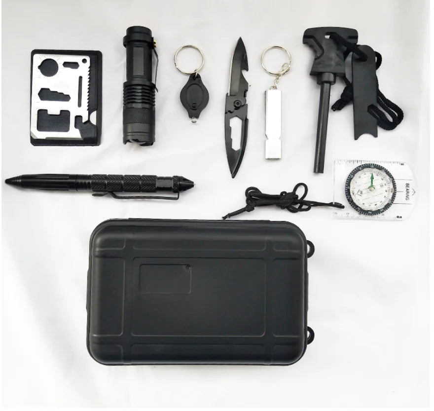 Collection of black survival tools including a knife, flashlight, and multitool on a white background.