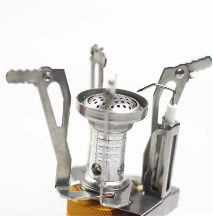 mini Portable camping stove with a white background