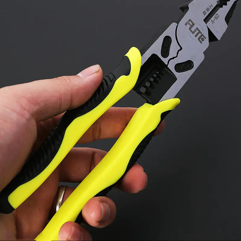 Hand holding a pair of yellow-handled multifunction pliers with a black and silver blade on a dark background