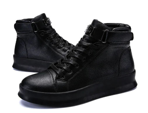 Black high-top sneakers with laces on a white background