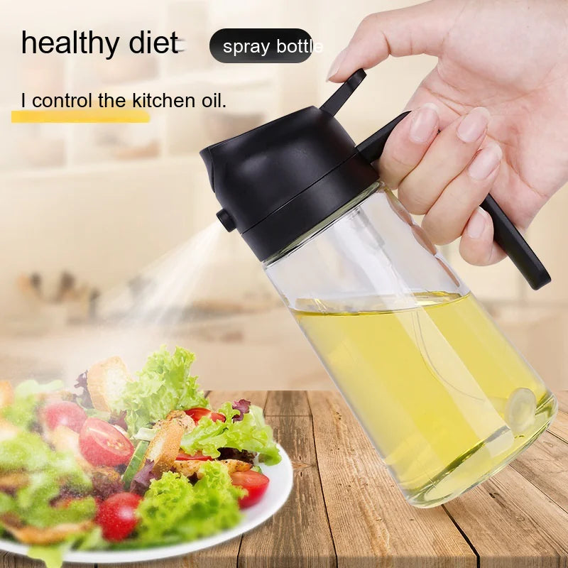 Hand holding an oil spray bottle with a salad in the background, emphasizing a healthy diet.