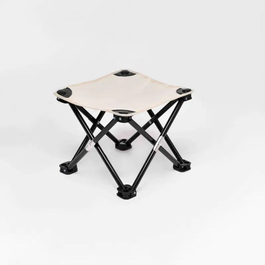 Small folding stool with black legs and a beige seat on a white background