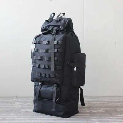 Black tactical backpack on a white background