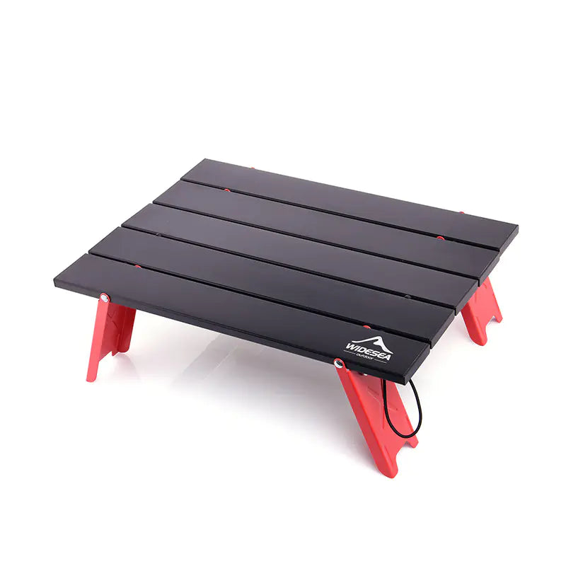 Black and red camping stool with a visible brand logo on a white background