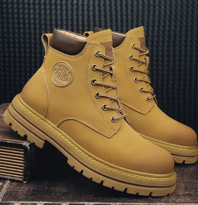 Pair of yellow boots with a brand logo on a dark textured background