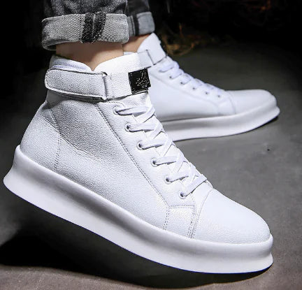 White high-top sneakers on a dark surface