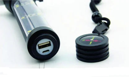 End of flashlight unscrewed showing port to recharge