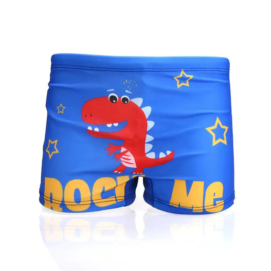 Blue children's swim shorts with a red dinosaur and 'Rock Me' text on a white background