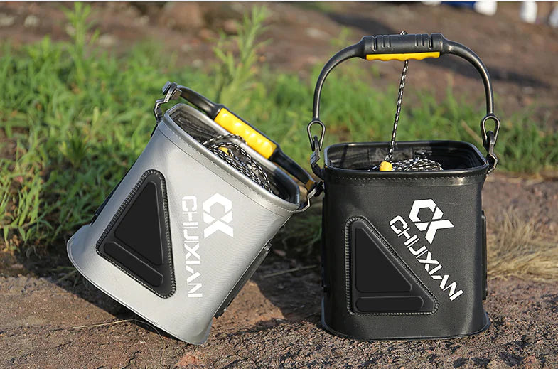 Two Chuxian branded fishing water buckets on a natural outdoor background