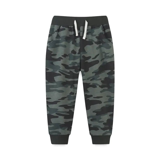 Camouflage-patterned pants with a black waistband on a white background