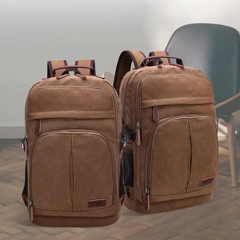 Two brown backpacks on a wooden floor with a chair in the background.