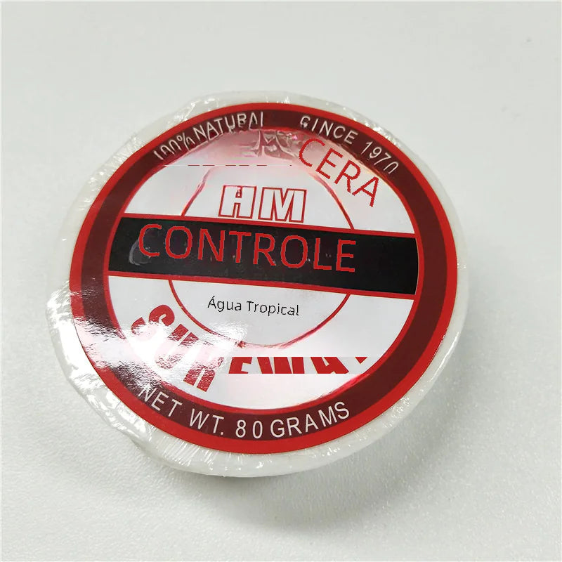 Container of HM Controle wax on a white background