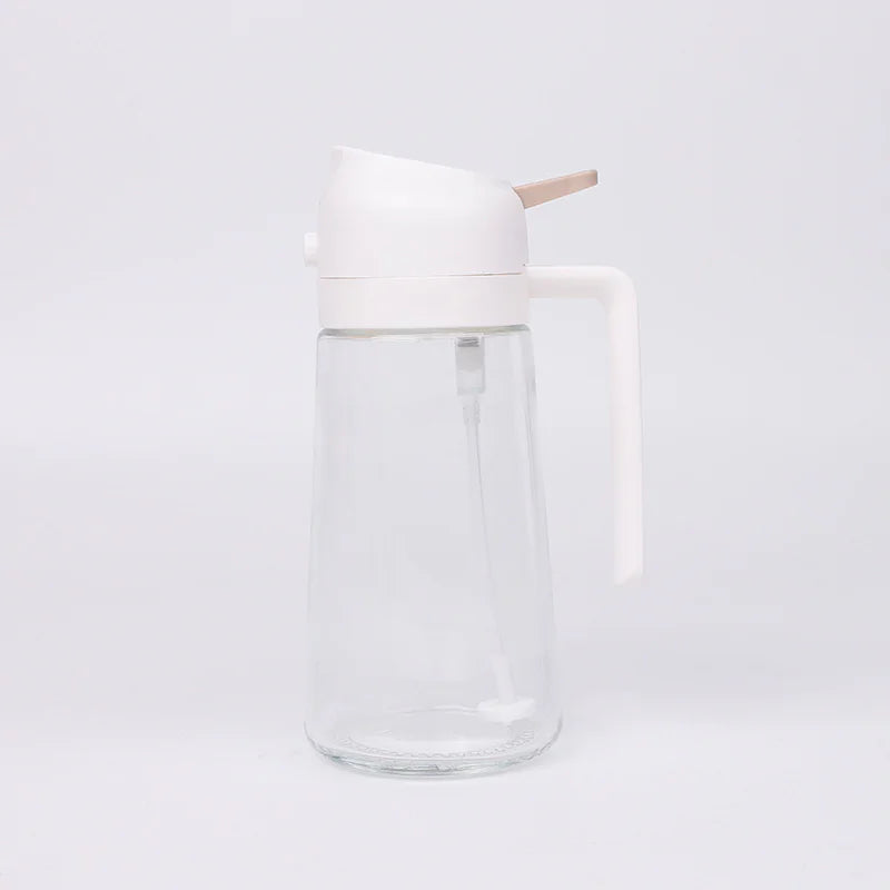 Clear glass carafe with a white lid on a light gray background