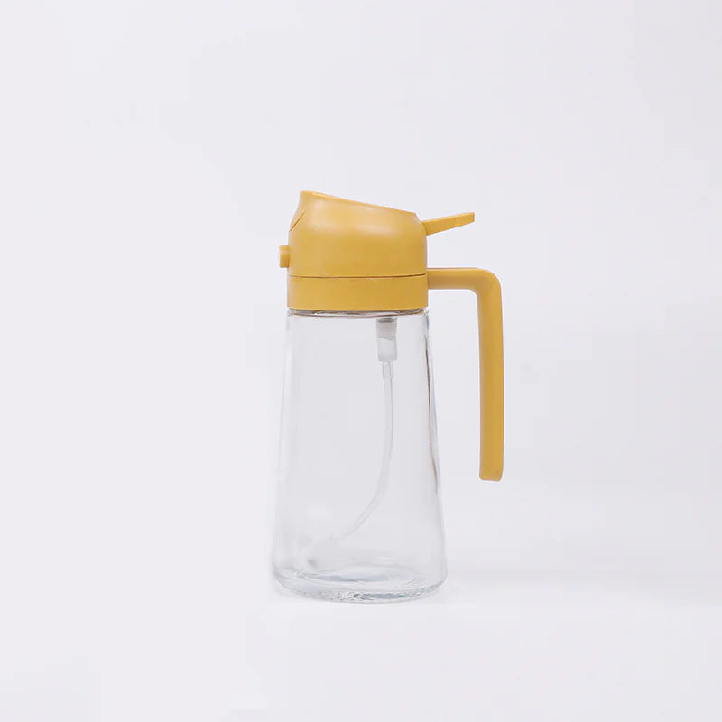 Clear glass bottle with a yellow lid and handle on a white background