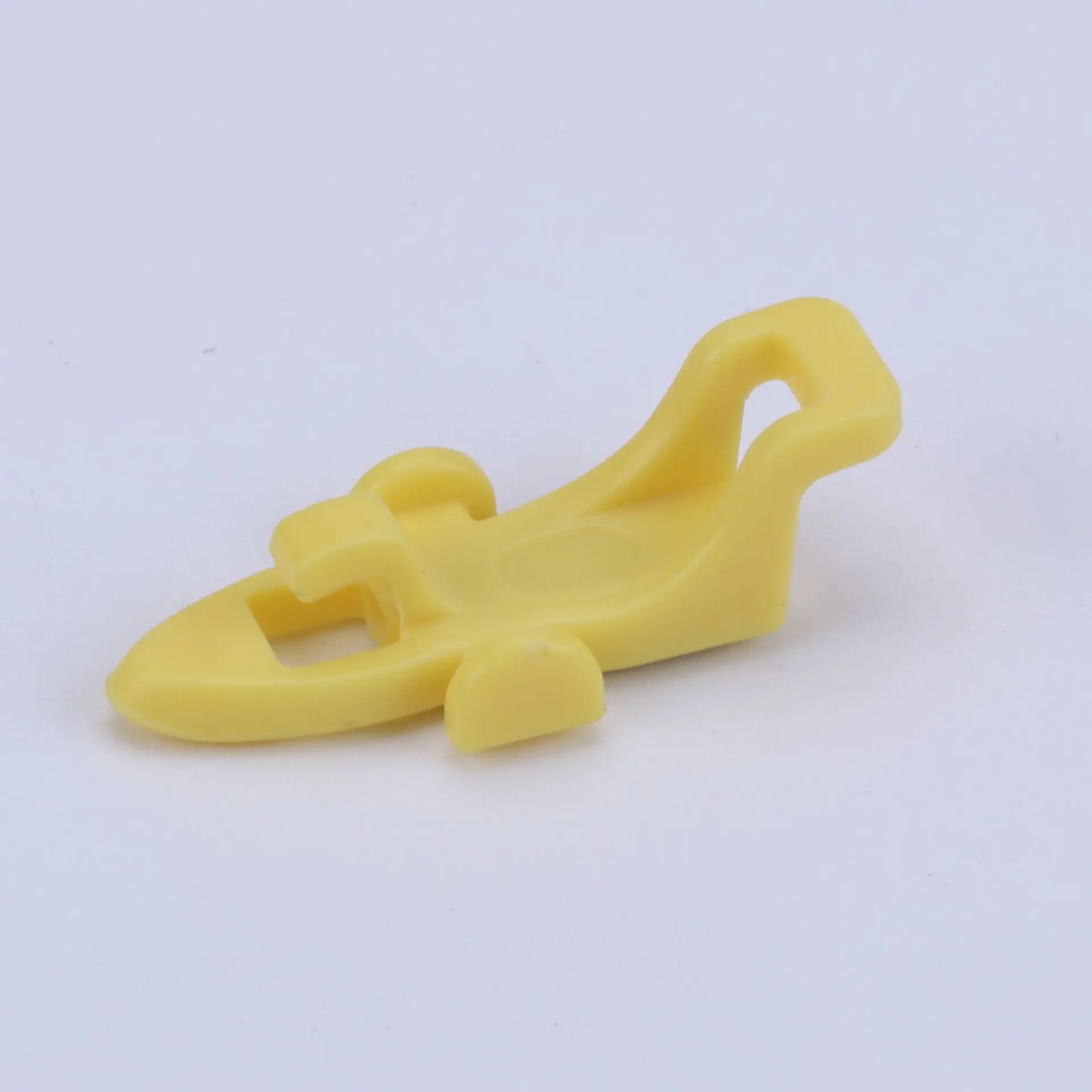 Yellow plastic bait hanger for fishing pole on a white background