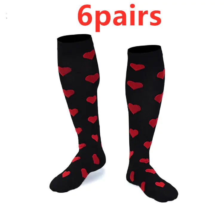 Black knee-high compression socks with red heart patterns on a white background, labeled '6 pairs'.