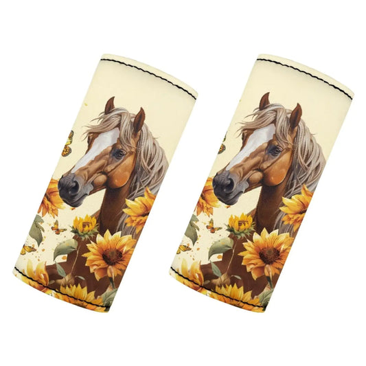 Two luggage handle sleeves with horse and sunflower design on a white background