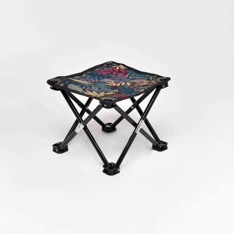 Small folding stool with a colorful floral pattern on a white background