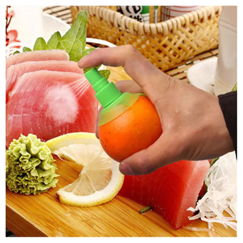 Hand holding a real orange that has a screwed in spray pump so you can spray juice directly from the fruit. Positioned over a cutting board of raw fish and  some veggies