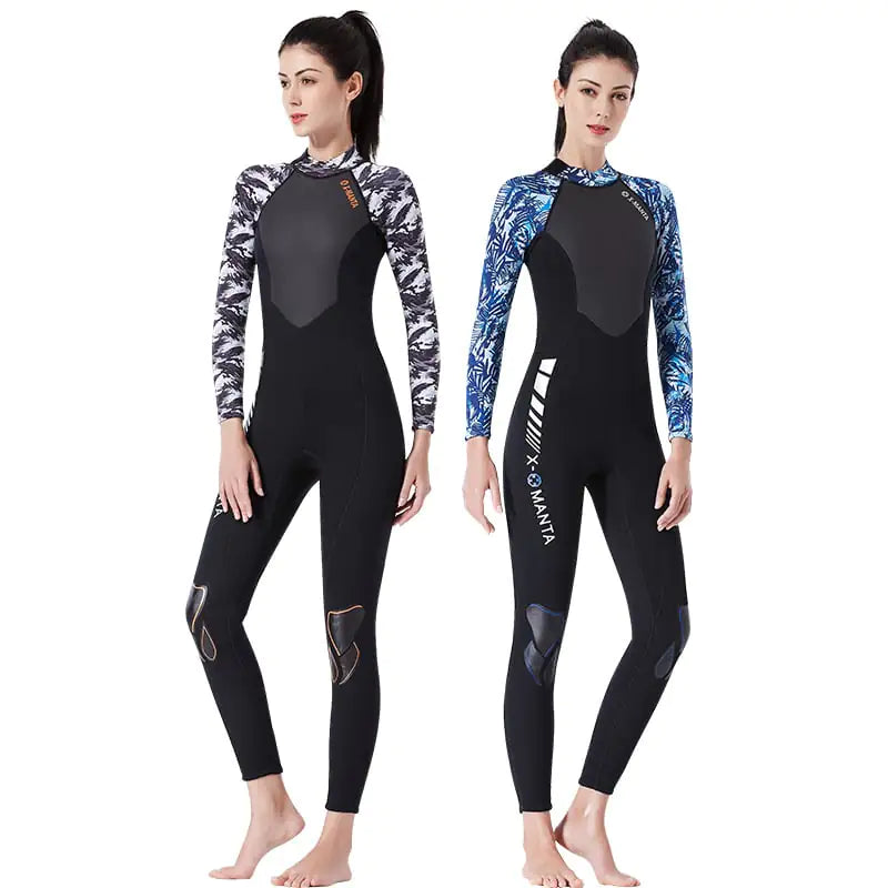 Two models wearing black wetsuits with patterned sleeves on a white background