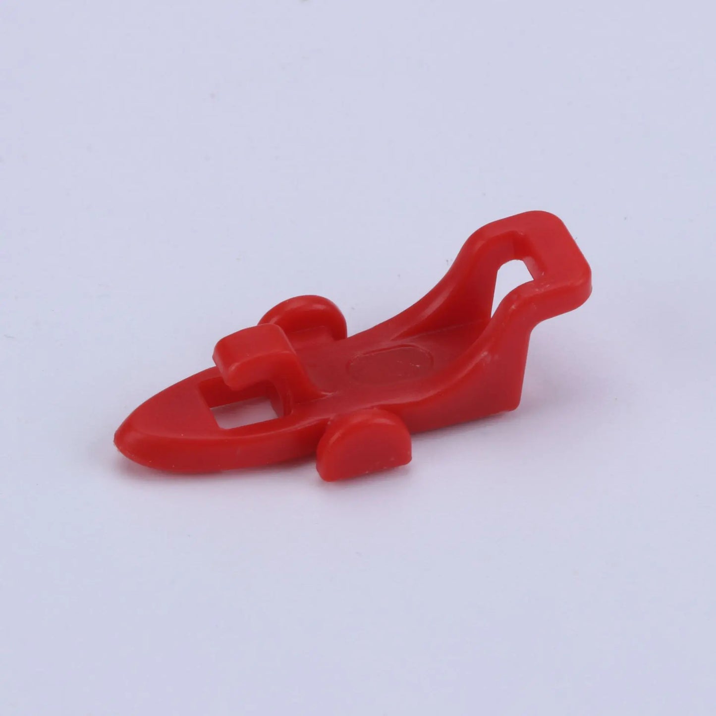 Red plastic bait hanger for fishing pole on a white background
