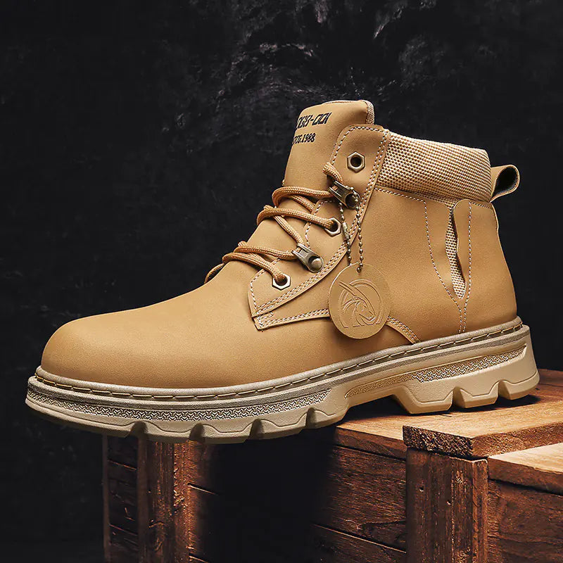 Tan boot with brand logo on a wooden block against a dark background