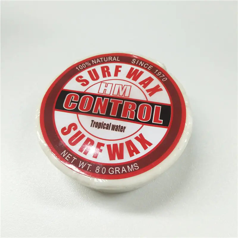 Surf wax container with red and white label on a light gray background