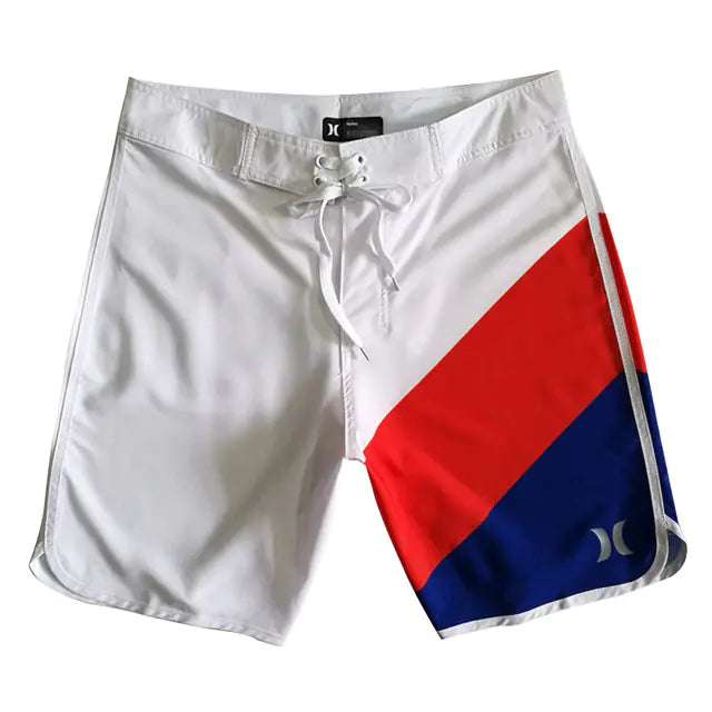 White board shorts with red and blue diagonal stripes on a white background