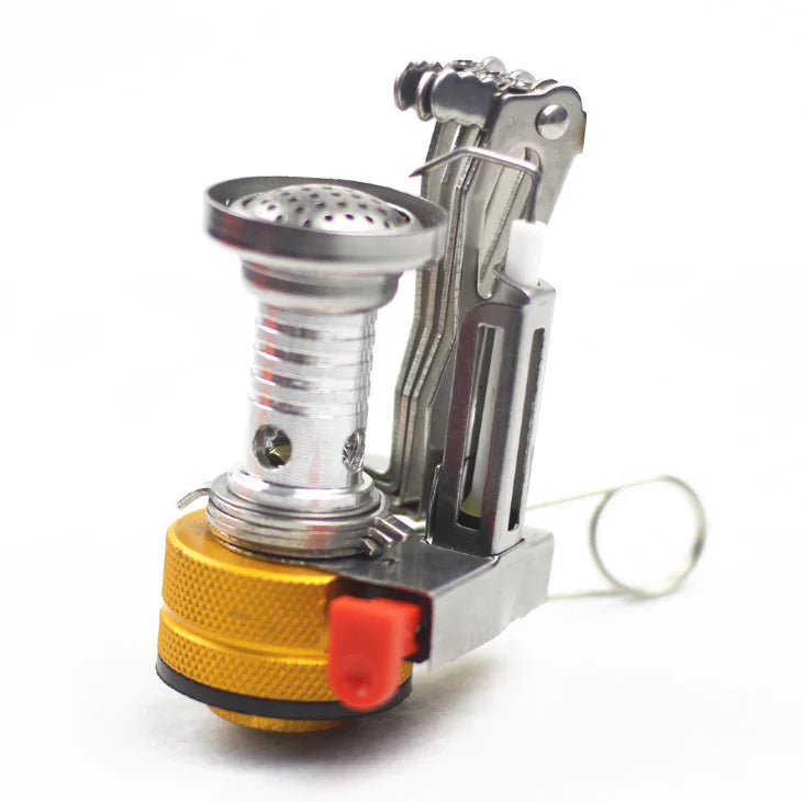 Portable stove with a metallic and gold design on a white background