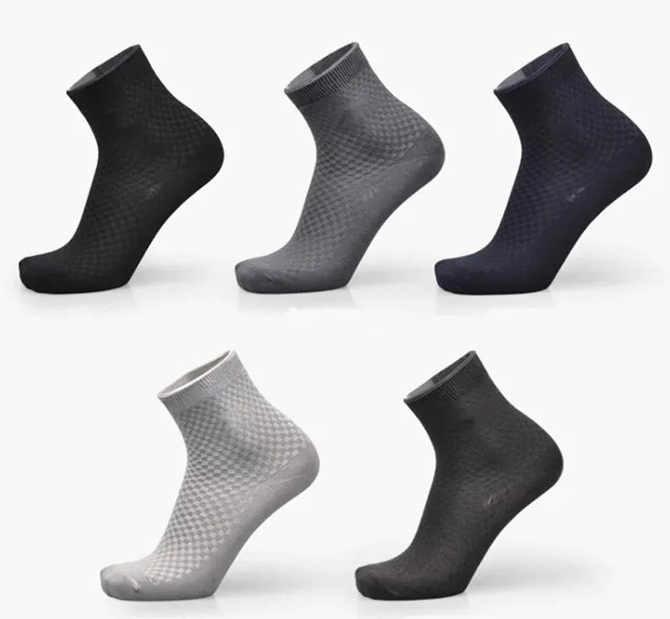 Set of six pairs of black and gray assorted bamboo socks on a white background