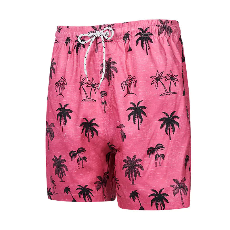 Pink swim shorts with black palm tree pattern on a white background