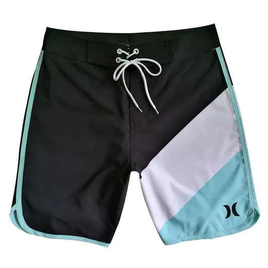 Black, white, and teal board shorts with a logo on a white background